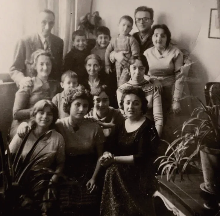 A large family gathered for a portrait, mid-twentieth century